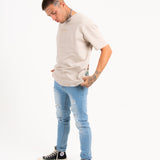 Logan Stretch Skinny Distressed Denim In Indigo Stonewash