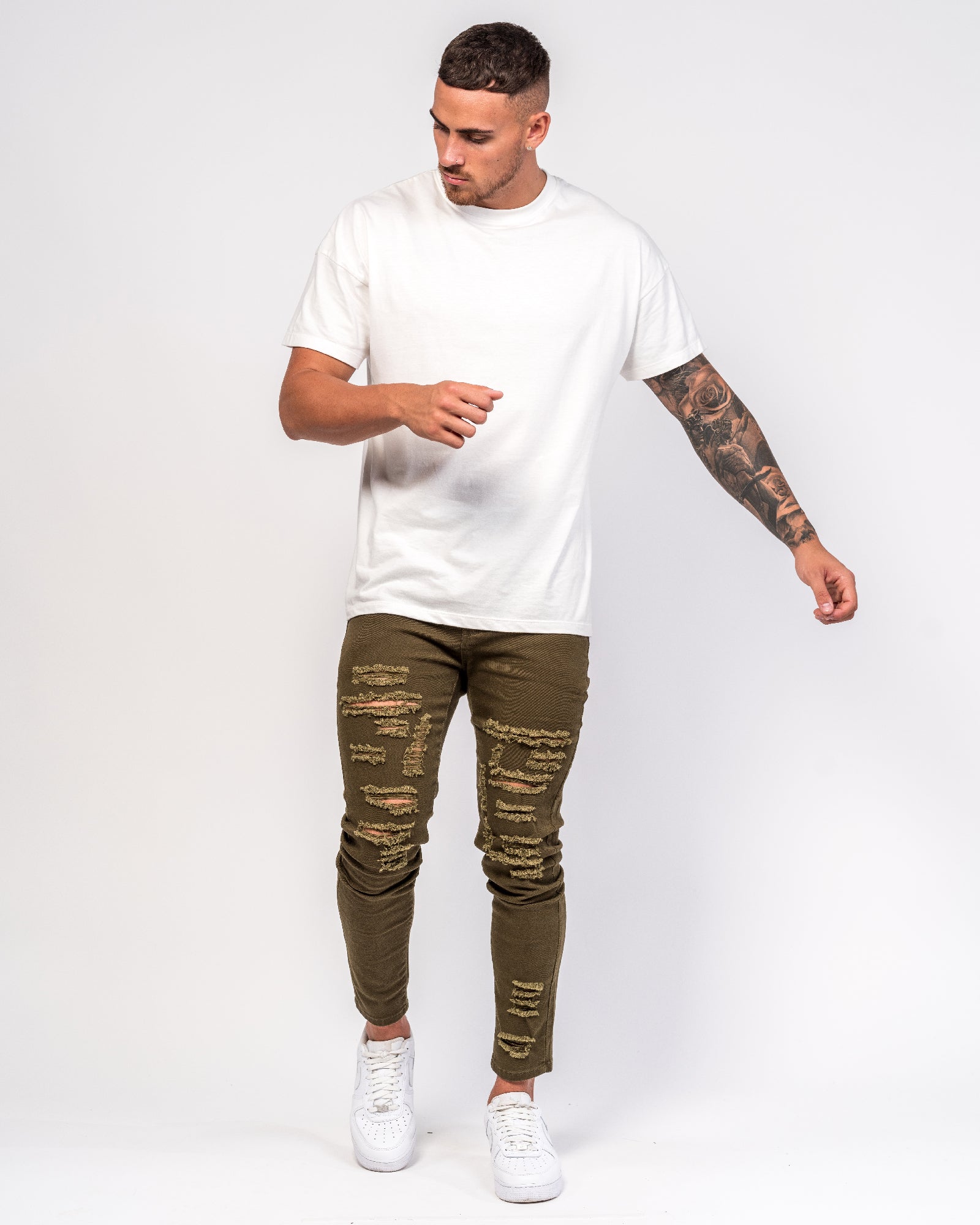 Logan Skinny Jeans With Distressing In Khaki