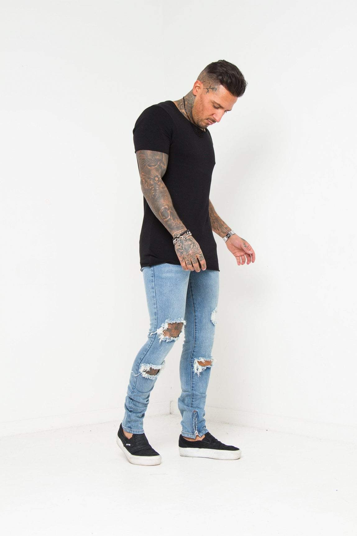 Logan Skinny Stretch Jeans In Light Stonewash With All Over Distressing And Zipped Ankle Hem - Liquor N Poker LIQUOR N POKER