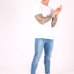 Logan Skinny Stretch Jeans In Light Stonewash With Ripped Knee - Liquor n Poker