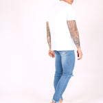 Logan Skinny Stretch Jeans In Light Stonewash With Ripped Knee - Liquor n Poker