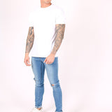 Logan Skinny Stretch Jeans In Light Stonewash With Ripped Knee - Liquor n Poker