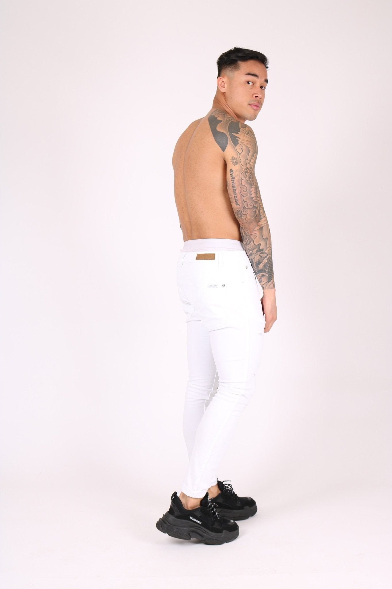 Logan Stretch Skinny Jeans In White With All Over Distressing - Liquor n Poker
