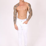 Logan Stretch Skinny Jeans In White With All Over Distressing - Liquor n Poker
