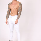 Logan Stretch Skinny Jeans In White With All Over Distressing - Liquor n Poker